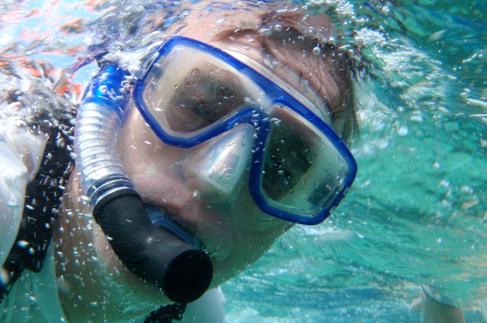 A snorkeler demonstrating proper breathing techniques underwater