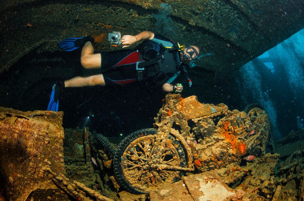 Scuba divers exploring a famous dive site, SS Thistlegorm in the Red Sea